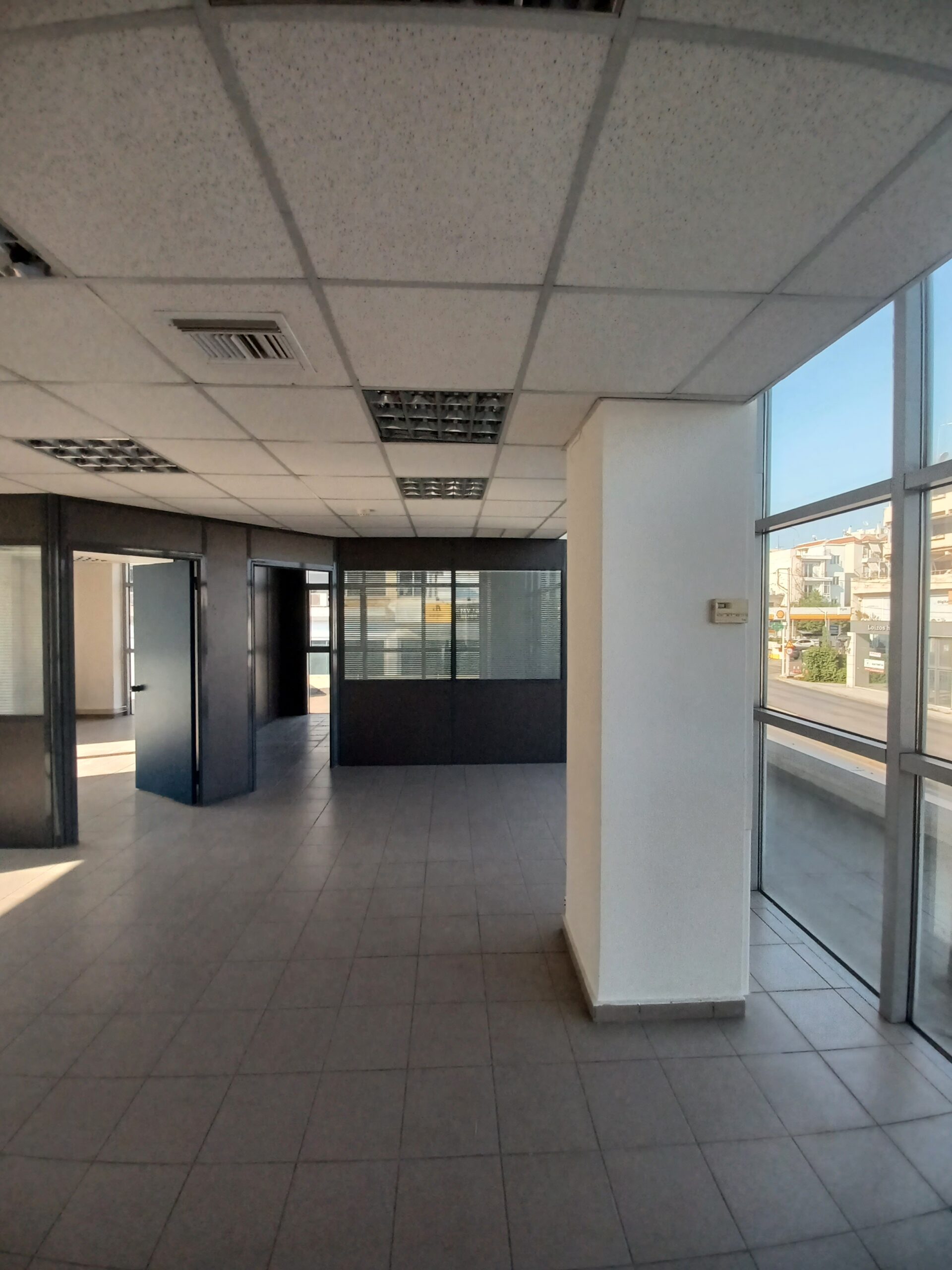 Office interior before renovation with outdated flooring, Athens Greece