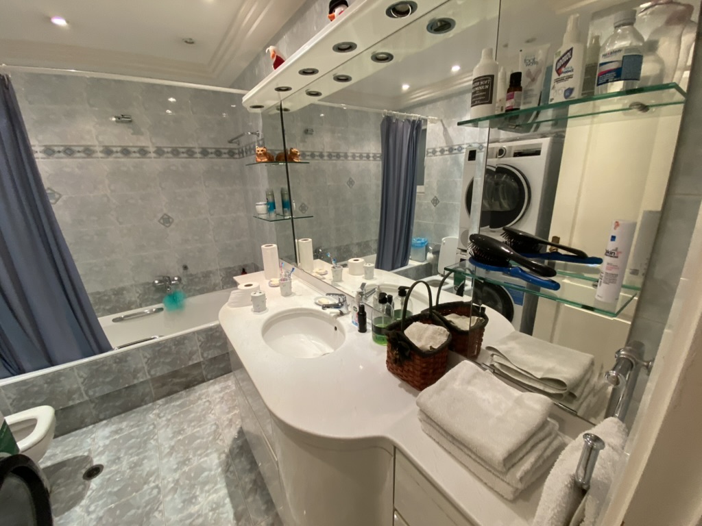 Bathroom before renovation with old tiles, Paleo Faliro Athens