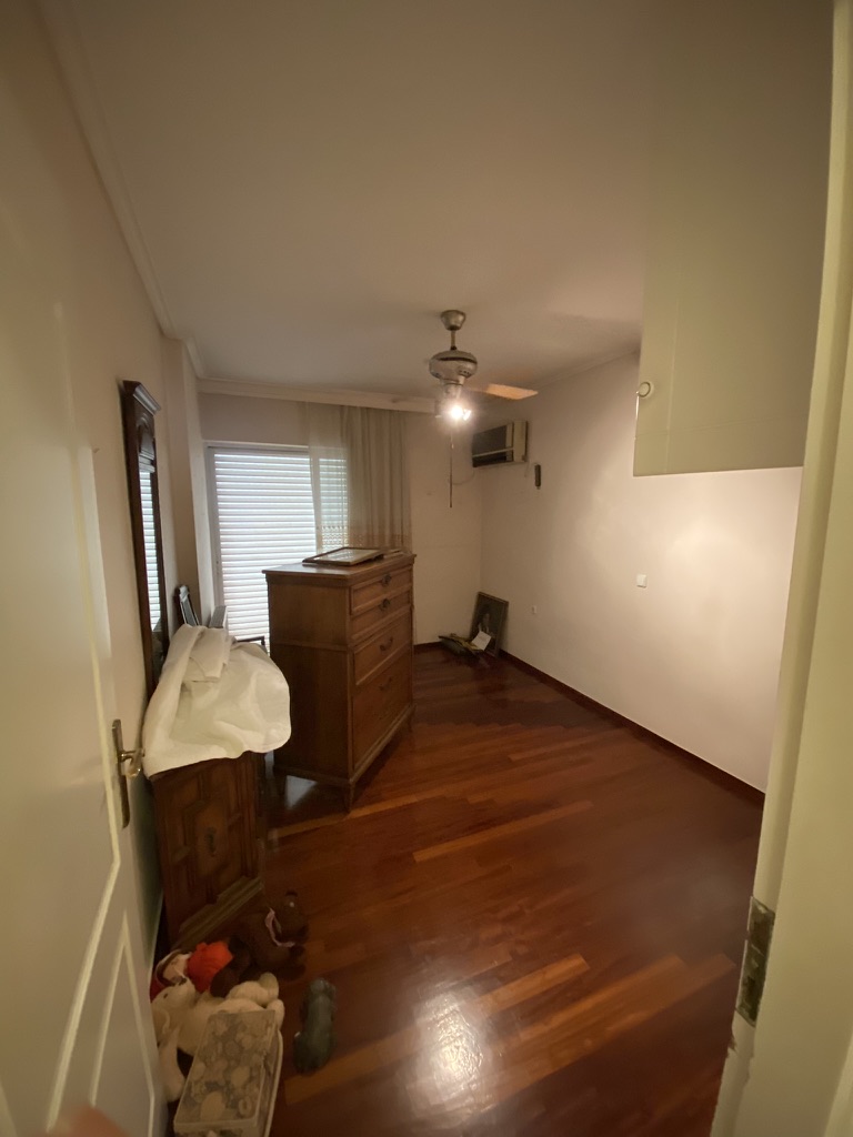 Bedroom before renovation with old flooring, Paleo Faliro