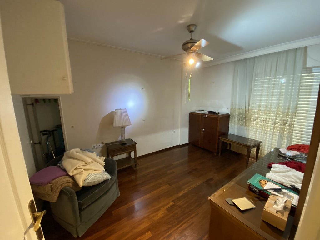 Minimal bedroom after renovation with natural light, Athens Greece